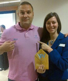 Matt Harris receiving a YWCA award alongside a YWCA representative